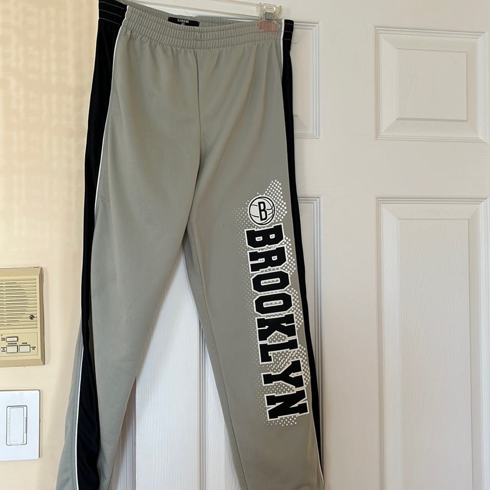 Long gray light weight pants, Brooklyn basketball fan